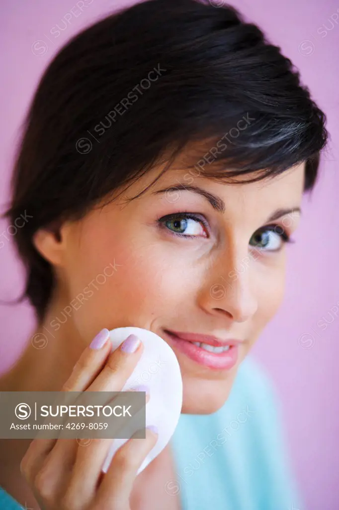 Woman removing make-up.