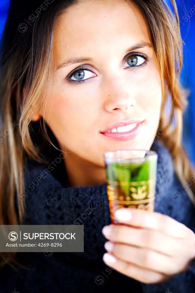 Woman drinking mint tea.