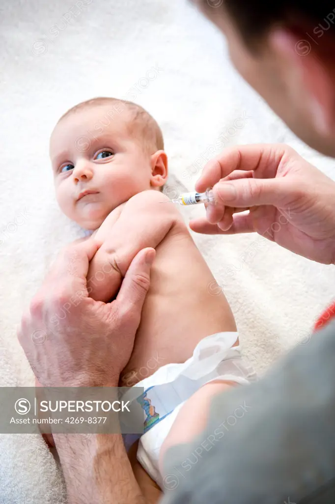 2 months old baby receiving vaccination.