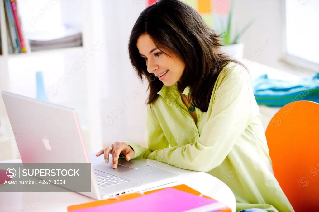 Woman using laptop computer.