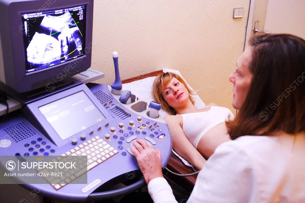 Second quarter pregnant woman undergoing an obstetrical ultrasound scan.