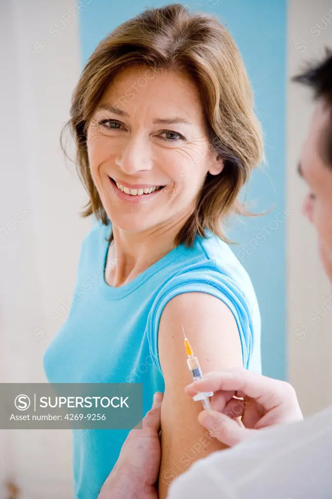 Woman receiving vaccination.