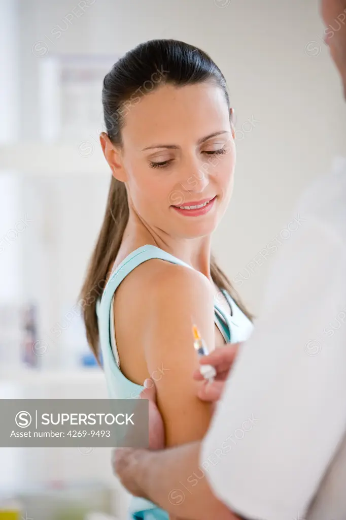 Woman receiving vaccination.