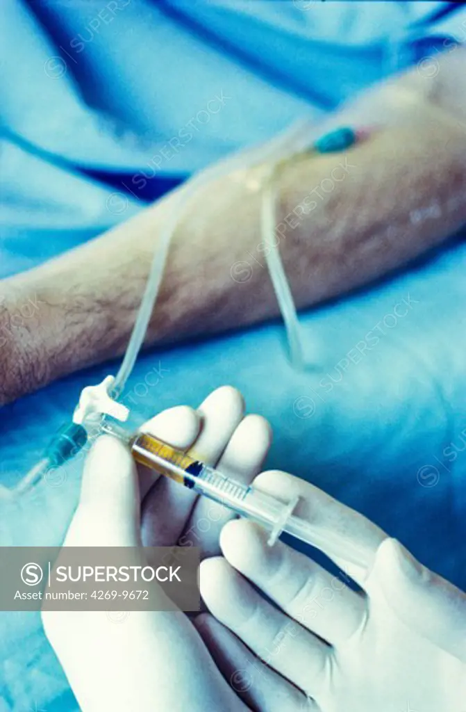Injection of drug in a drip.