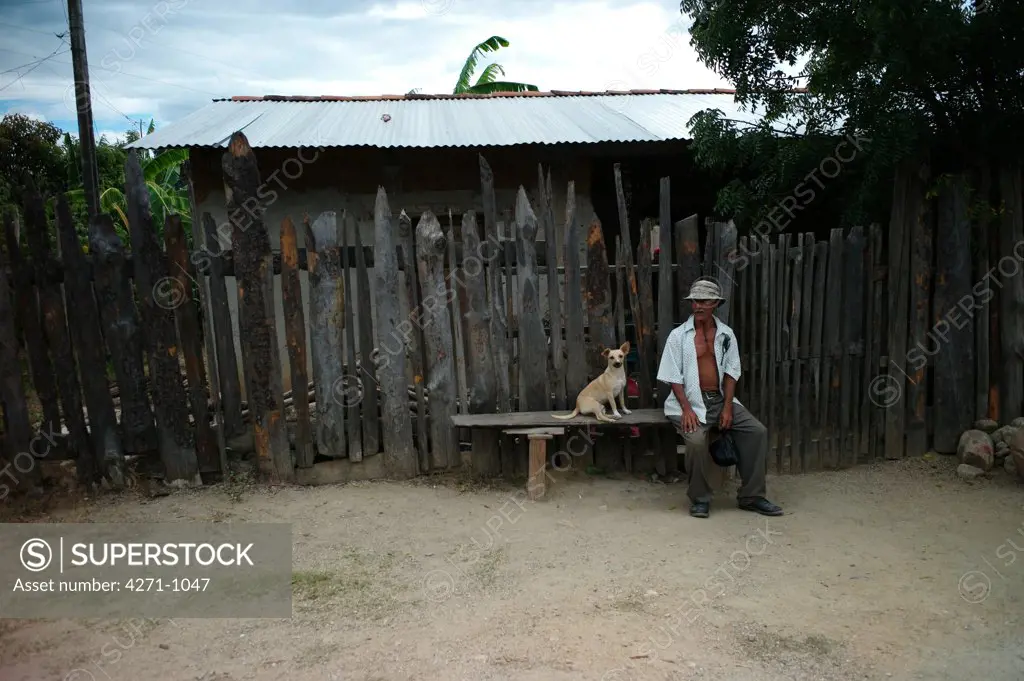 Nicaragua, Dipilto, Portrait of farmer with dog in town of the mountainous Nueva Segovia
