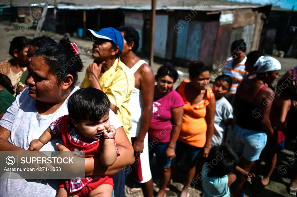 Nicaragua, Managua, Families in line at La Chureca Industrial waste disposal site