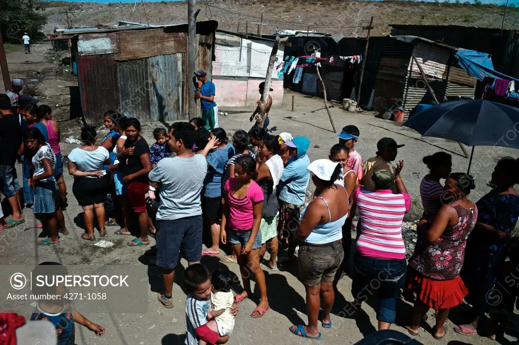 Nicaragua, Managua, Families in line at La Chureca Industrial waste disposal site
