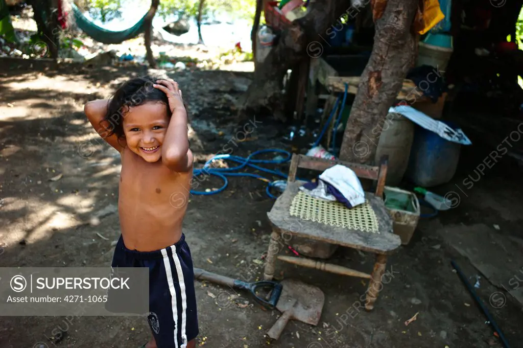 Nicaragua, Managua, Child playing at La Chureca Industrial waste disposal site