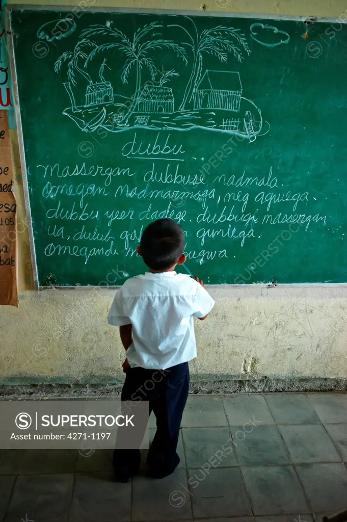 Panama, Kuna Yala, Guna Indigenous student at Spanish-Guna bilingual school in Ustupu