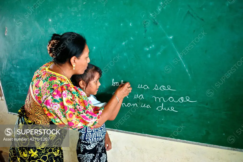Panama, Kuna Yala, Guna Indigenous student and teacher at Spanish-Guna bilingual school in Ustupu
