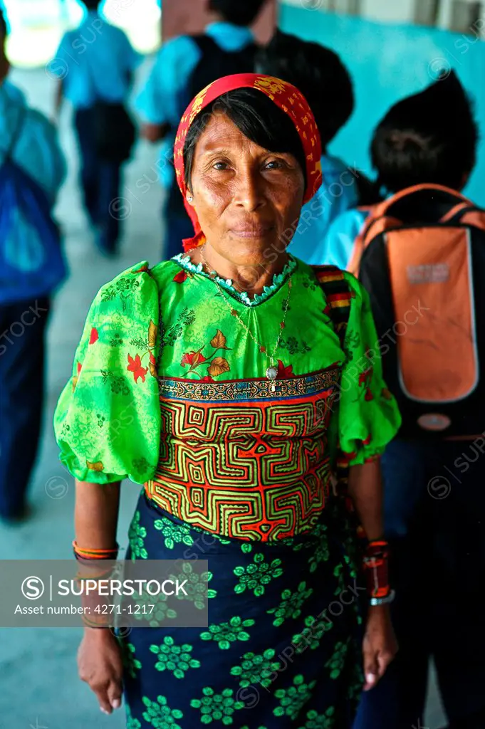 Panama, Kuna Yala, Guna Indigenous teacher wearing traditional mola at Spanish-Guna bilingual school in Ustupu