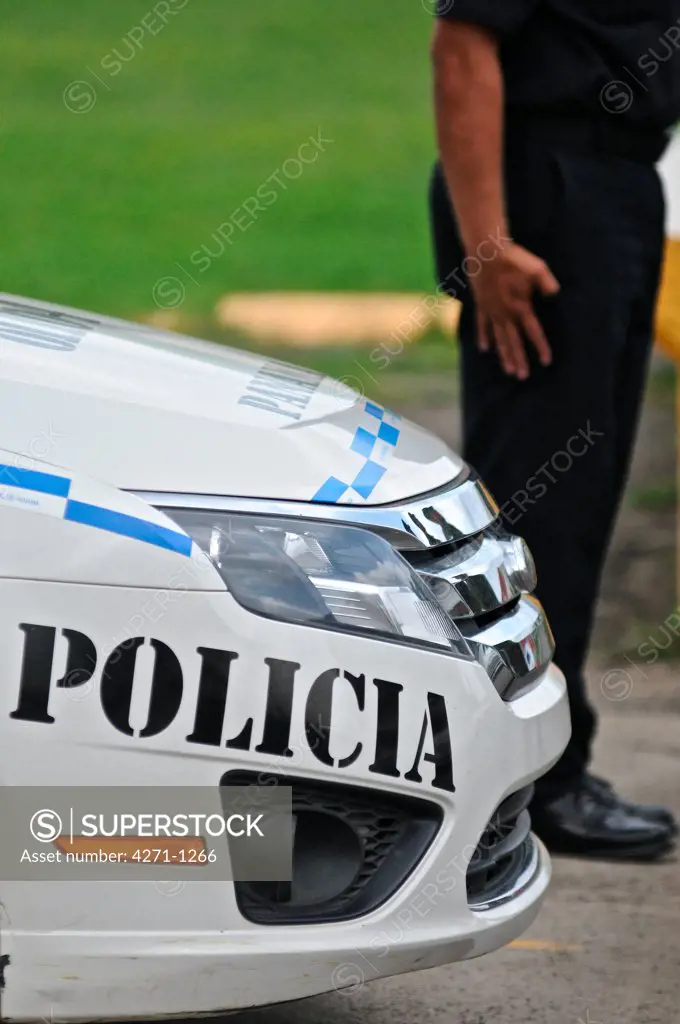 Policeman standing near a car, Panama