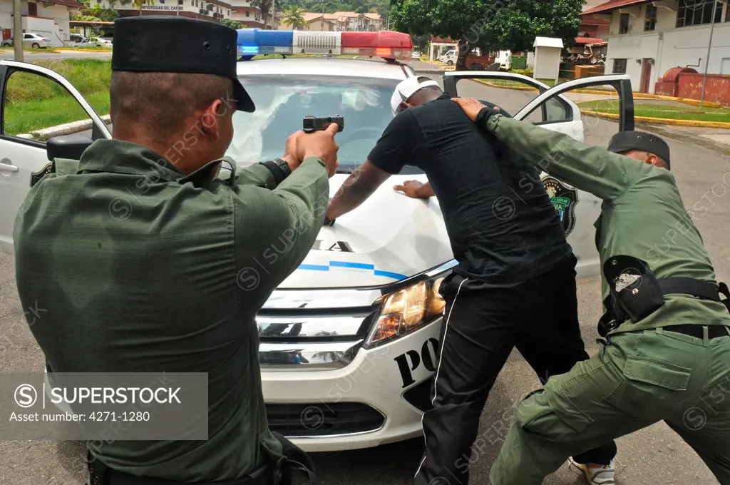 Uniformed police officers arrested a criminal at a tactical and firearms training course at the Panamanian National Police force academy, Panama