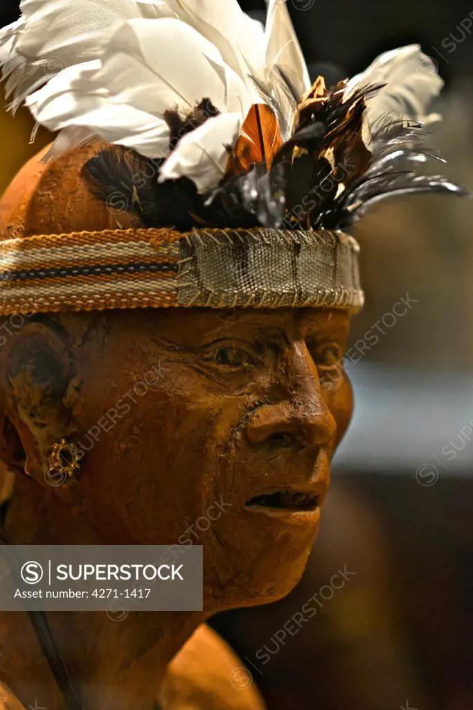 Costa Rica, San Jose, Pre-Columbian Gold Museum, Figurine of warrior. Political and religious leadership rolls represented. Recreation of Pre-Columbian communities