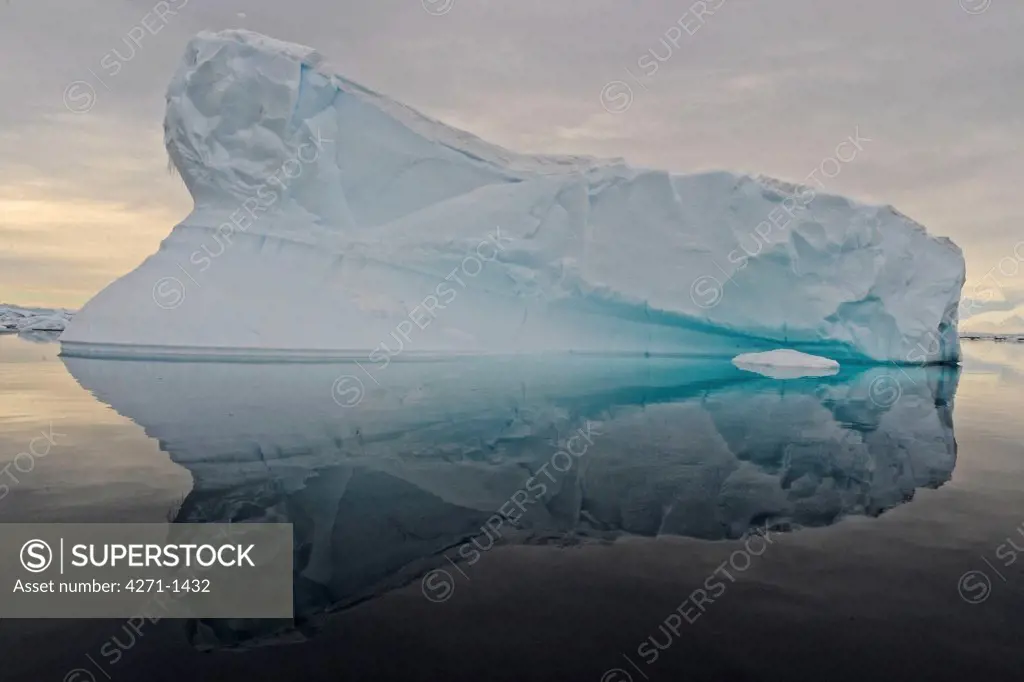 Antarctic, Pleneau Island, Beautiful icebrg reflecting in calm water