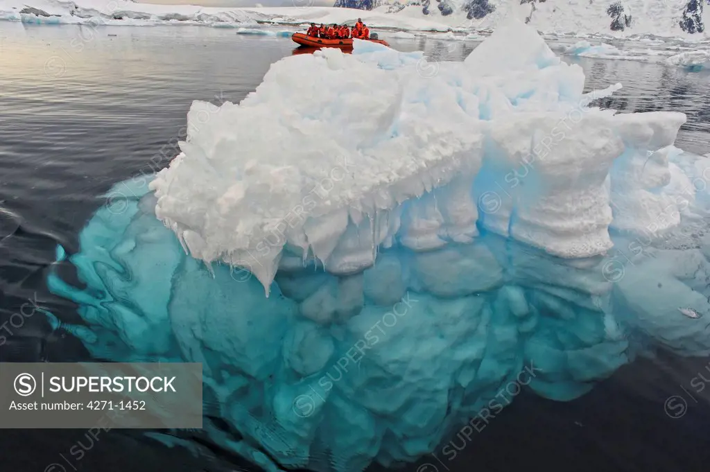 Antarctica, Pleneau island, Tourists explore arctic sea on a zodiac