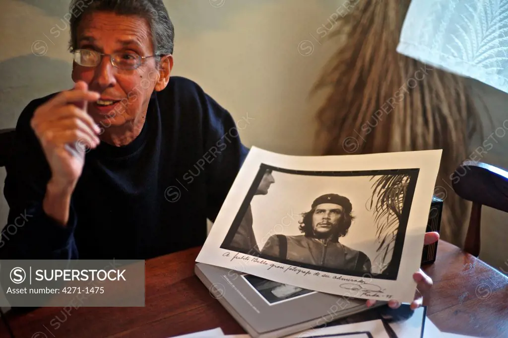 Cuba, Havana, Photographer holding signed photograph of Che Guevara