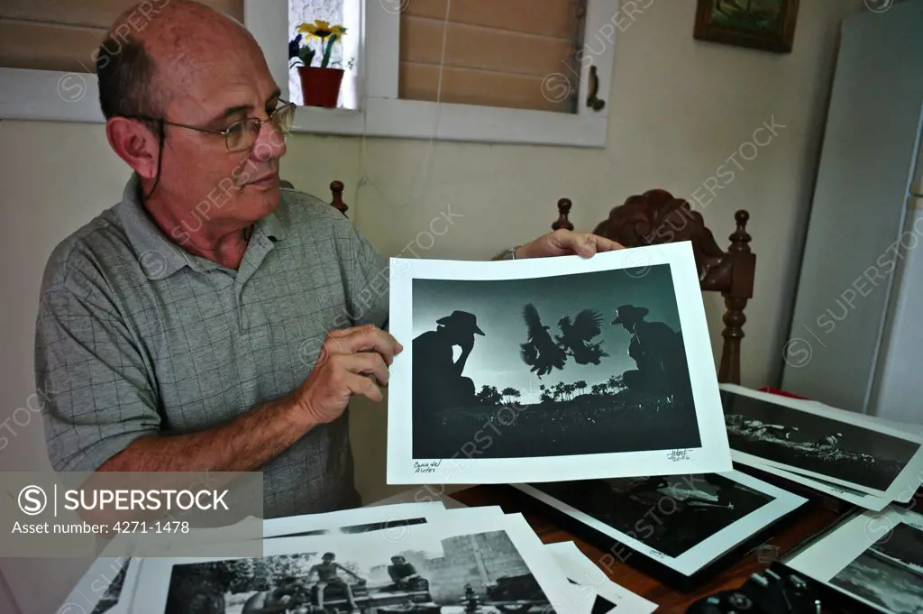 Cuba, Havana, Photographer at his home