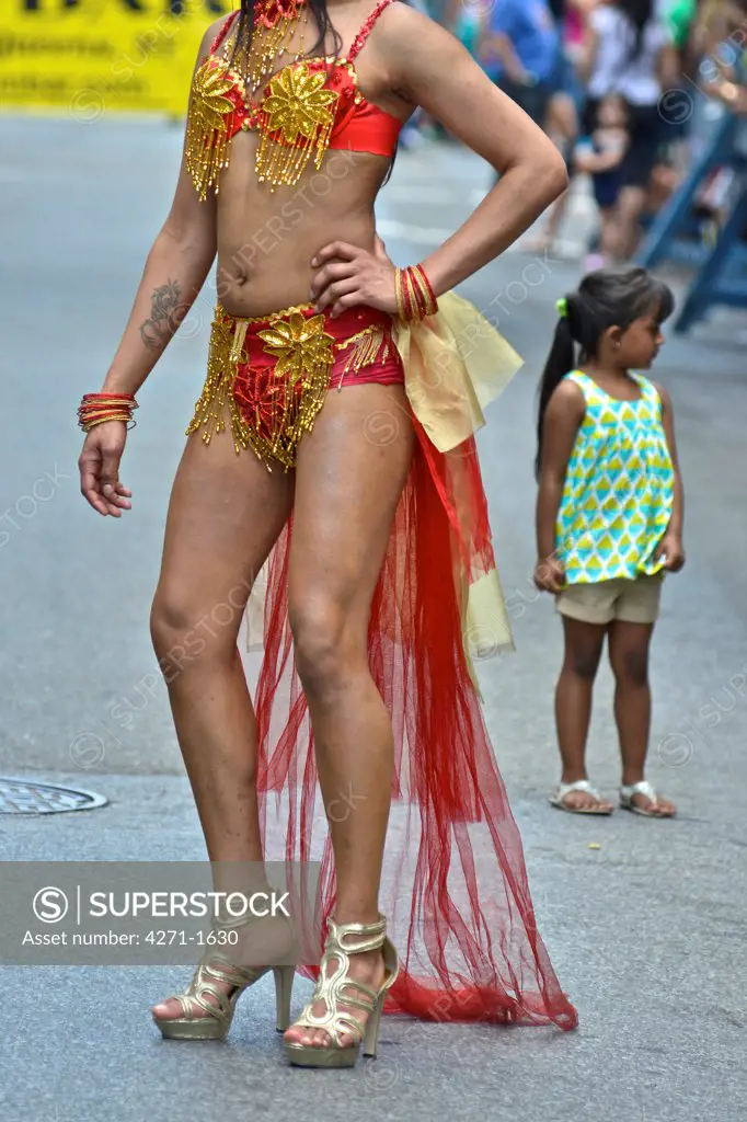 USA, New York State, New York City, Jackson Heights neighborhood, Man wearing costume and girl on street during 2013 Queens Pride
