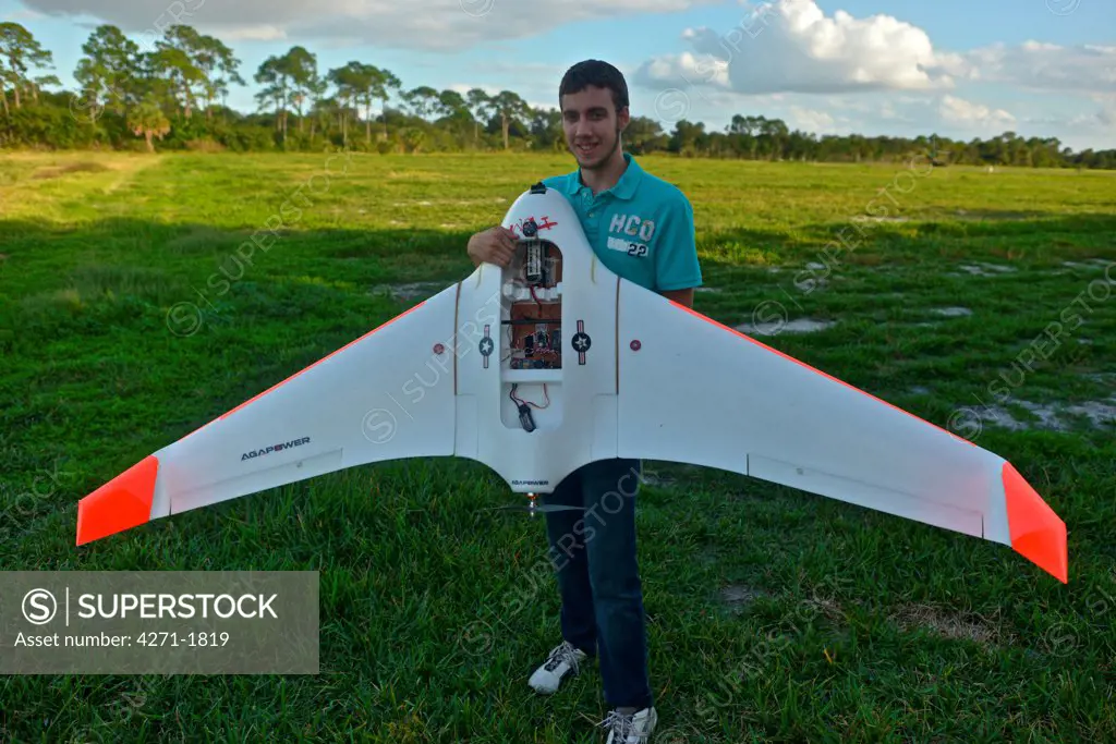 Student holding classic flying wing
