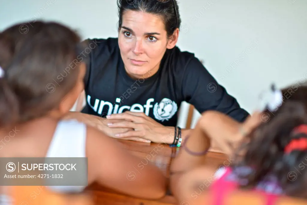 UNICEF Ambassador Angie Harmon meets with two eleven year old girls who have experienced sexual abuse. January 22, 2014. (Kike Calvo / U.S. FUND FOR UNICEF via AP Images)