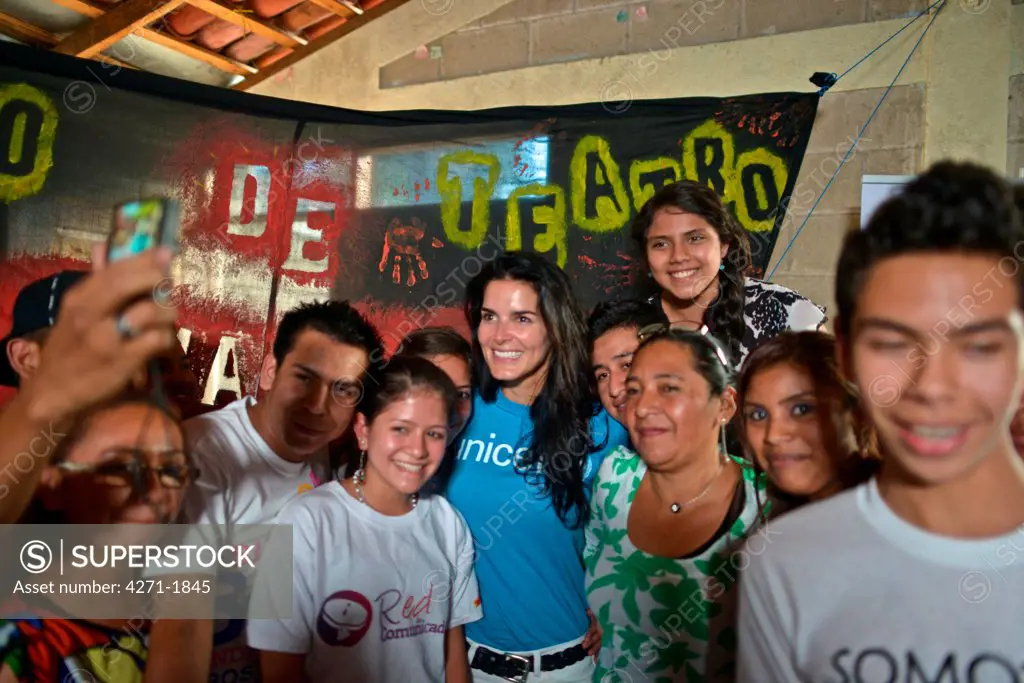 UNICEF Ambassador Angie Harmon poses for a group photo with youth leaders who are disseminating messages in their communities about the prevention of child trafficking. January 21, 2014. (Kike Calvo / U.S. FUND FOR UNICEF via AP Images)
