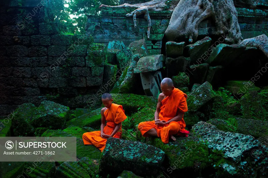 Theravada Buddhists from Phras Ang Tep Monastery at Ta Prohm Jungle Temple (Angkor Complex)