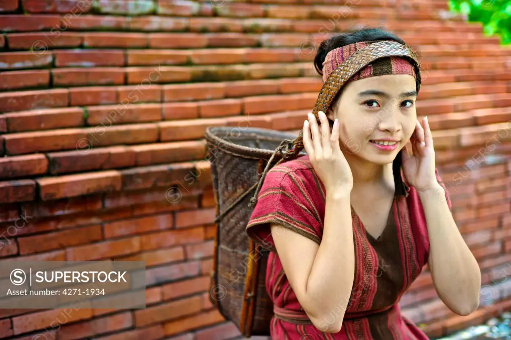 Teen girl wearing a Khmu country side traditional dress in Laos. Name: Anna Saksena
