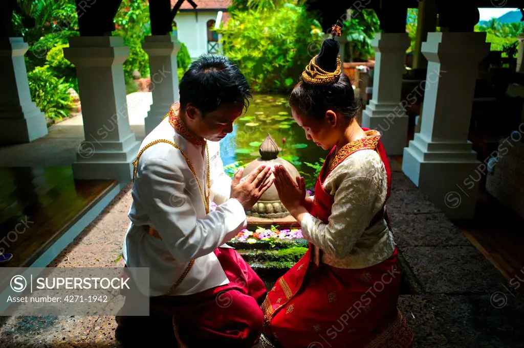 Bride and groom wearing a Lao traditional wedding Gown. Groom: Phoun Savath Bride: Many Lao