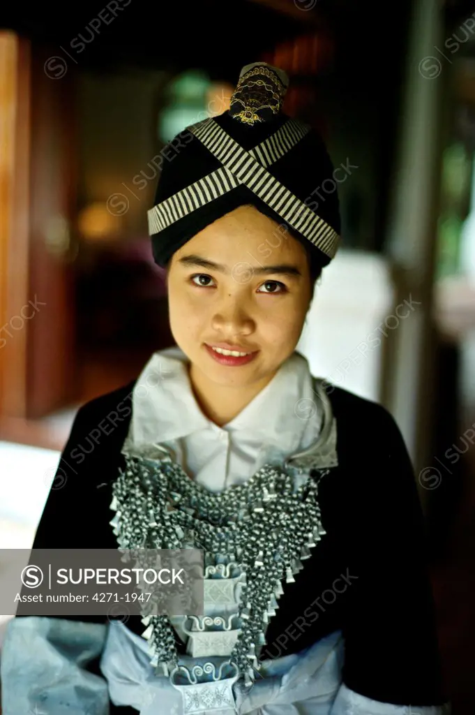 Young girl wearing a Hmong Kao traditional dress in Laos. Name: Anna Saksena
