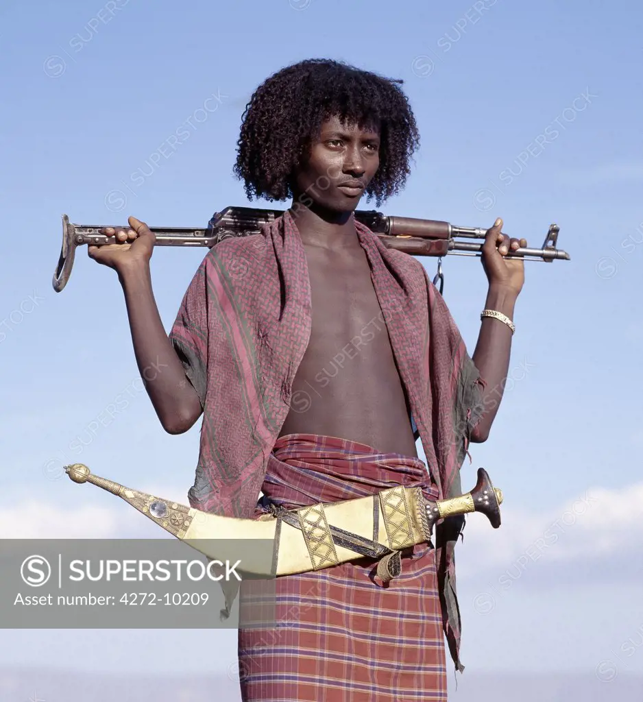 Warriors of the nomadic Afar tribe wear their hair long and carry large curved daggers, known as jile, strapped to their waists. Proud and fiercely independent, they live in the low lying deserts of Eastern Ethiopia. Many Ethiopians from the Highlands fear them.