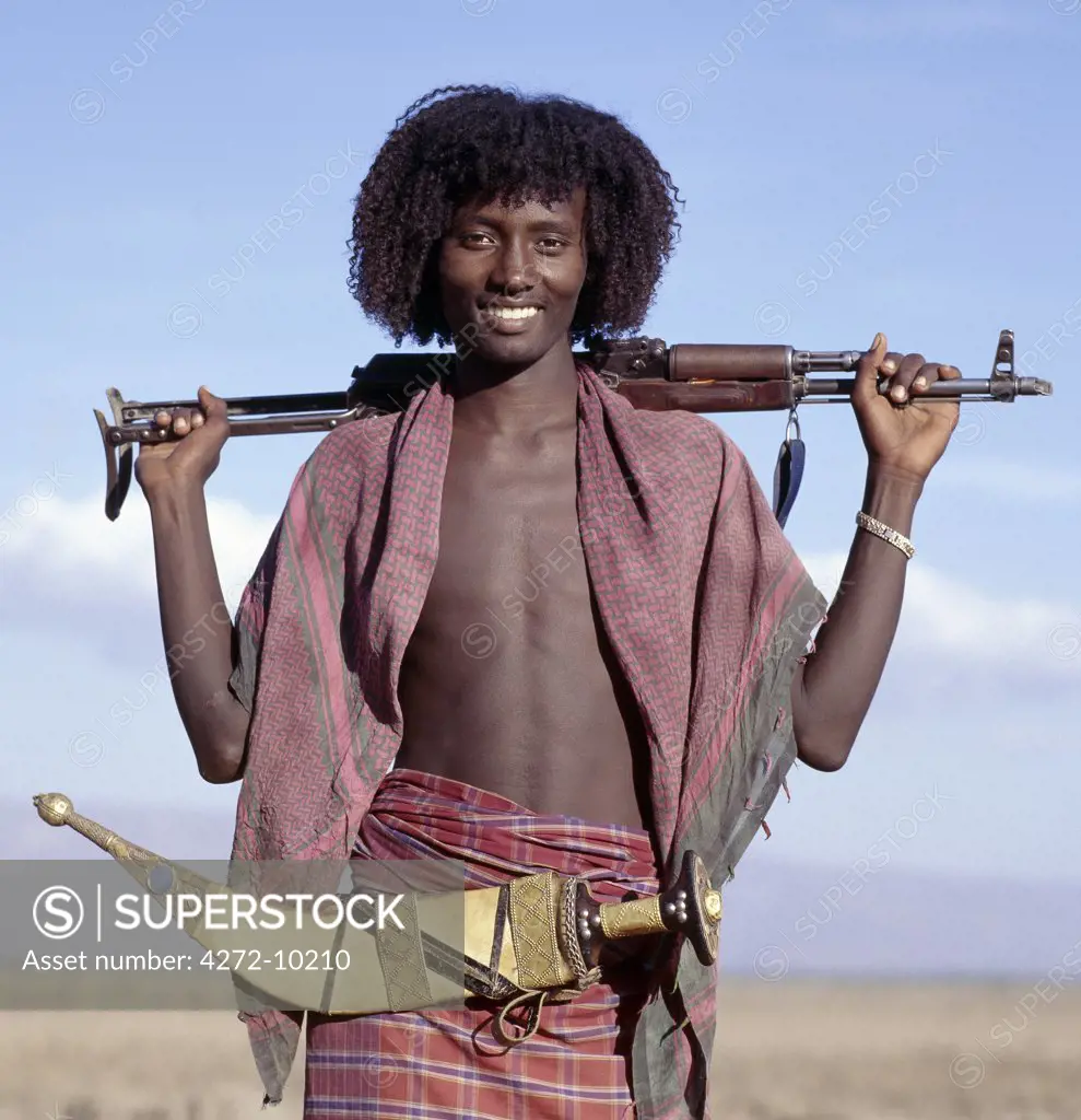 Warriors of the nomadic Afar tribe wear their hair long and carry large curved daggers, known as jile, strapped to their waists. Proud and fiercely independent, they live in the low lying deserts of Eastern Ethiopia. Many Ethiopians from the Highlands fear them.