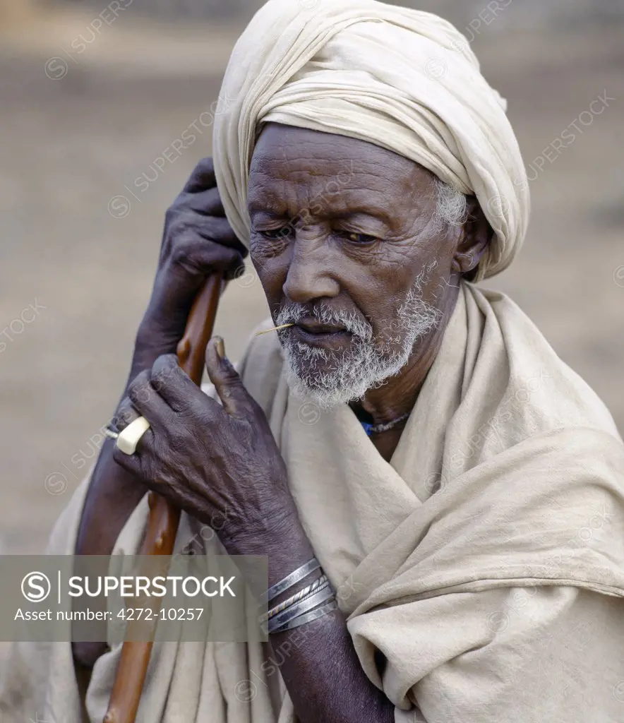 An old Borana man at Chew Bet in southern Ethiopia. His unbleached cotton wrap and turban are typical of the older generation of his tribe.The pastoral Borana live either side of the southern Ethiopian/northern Kenya border and form a large and important group of the Oromo-speaking cluster of tribes.
