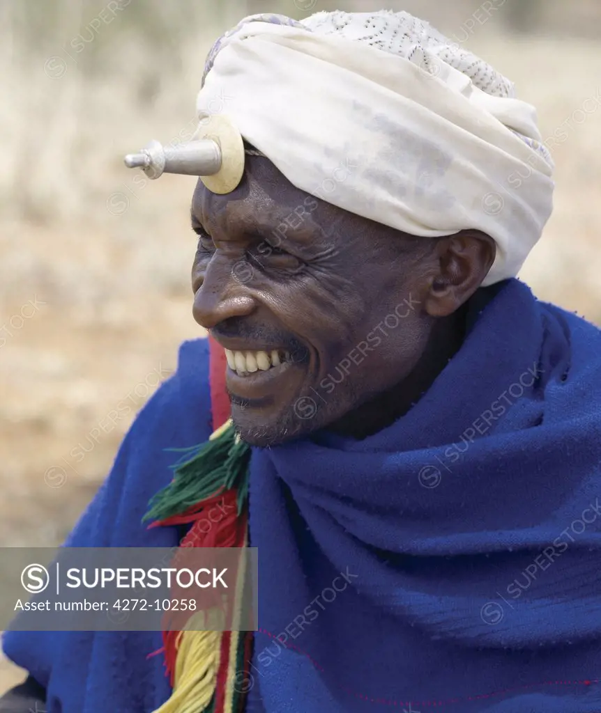 A Borana man at Mega in southern Ethiopia wears a phallic Kallaacha on his forehead. Made of cast aluminium and ivory or bone, the Kallaacha is worn during the tribe's initiation and gada age-grade ceremonies. The pastoral Borana live either side of the southern Ethiopian/northern Kenya border and form a large and important group of the Oromo-speaking cluster of tribes.