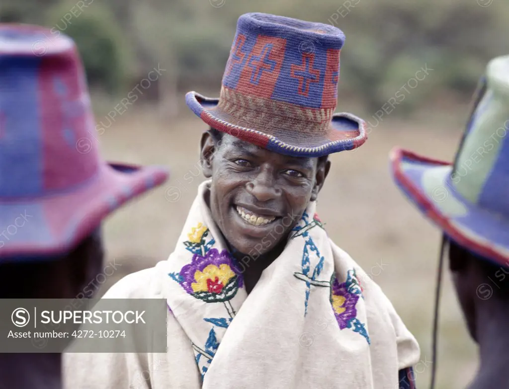 Konso men wear stylish, brightly-coloured hats, which they weave from locally-grown cotton.  Only men work the wooden looms but women flay the cloth to flatten the warp and weft.  Much of their production is used to make the voluminous skirts of Konso women.
