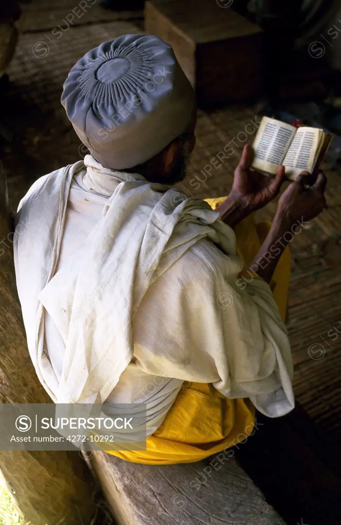 At a Lake Tana church a pilgrim reads a holy text of the Ethiopian Orthodox Church.