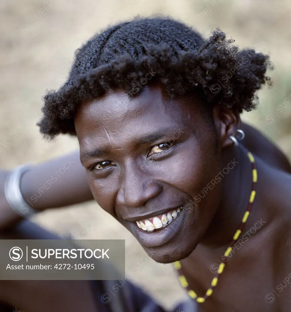 An unusual braided hairstyle of a Dassanech young man of the Omo River Delta.The Omo Delta of southwest Ethiopia is one of the least accessible and least developed parts of East Africa. As such, the culture, social organization, customs and values of the people have changed less than elsewhere.