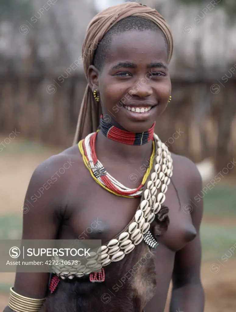 An attractive Hamar woman at Dimeka, the largest market in the Hamar country of Southwest Ethiopia. People travel there great distances on foot to attend the weekly commercial and social event.