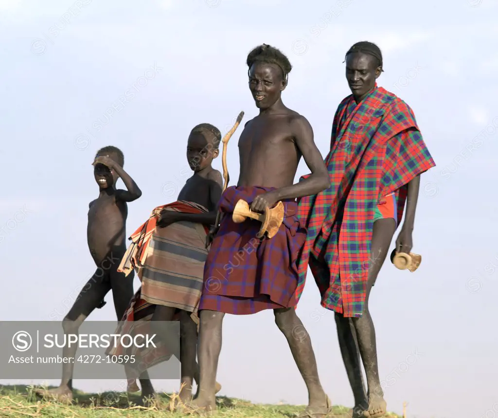 A group of Dassanech walk along a bank of the Omo River in Southwest Ethiopia.The Dassanech speak a language of Eastern Cushitic origin. They live in the Omo Delta and they practice animal husbandry and fishing as well as agriculture.