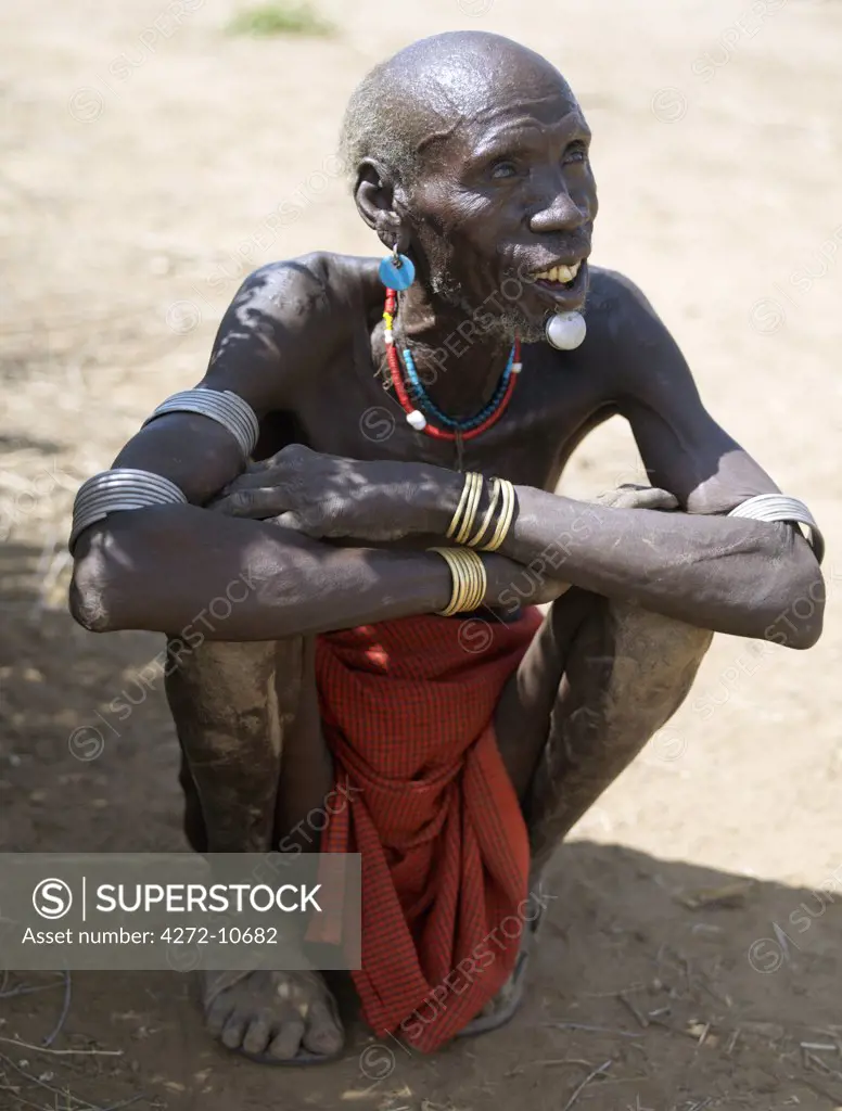 An old Kwegu man with a lip ornament made of aluminium. The Kwegu are the smallest tribe living on the banks the Omo River in southwest Ethiopia.