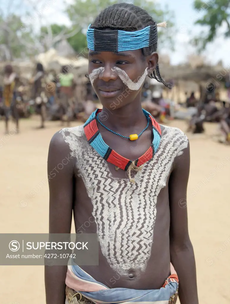 A smart young Hamar youth at Turmi Market.The Hamar are semi-nomadic pastoralists who live in harsh country around the Hamar Mountains of Southwest Ethiopia. Their whole way of life is based on the needs of their livestock.  Cattle are economically and culturally their most important asset.