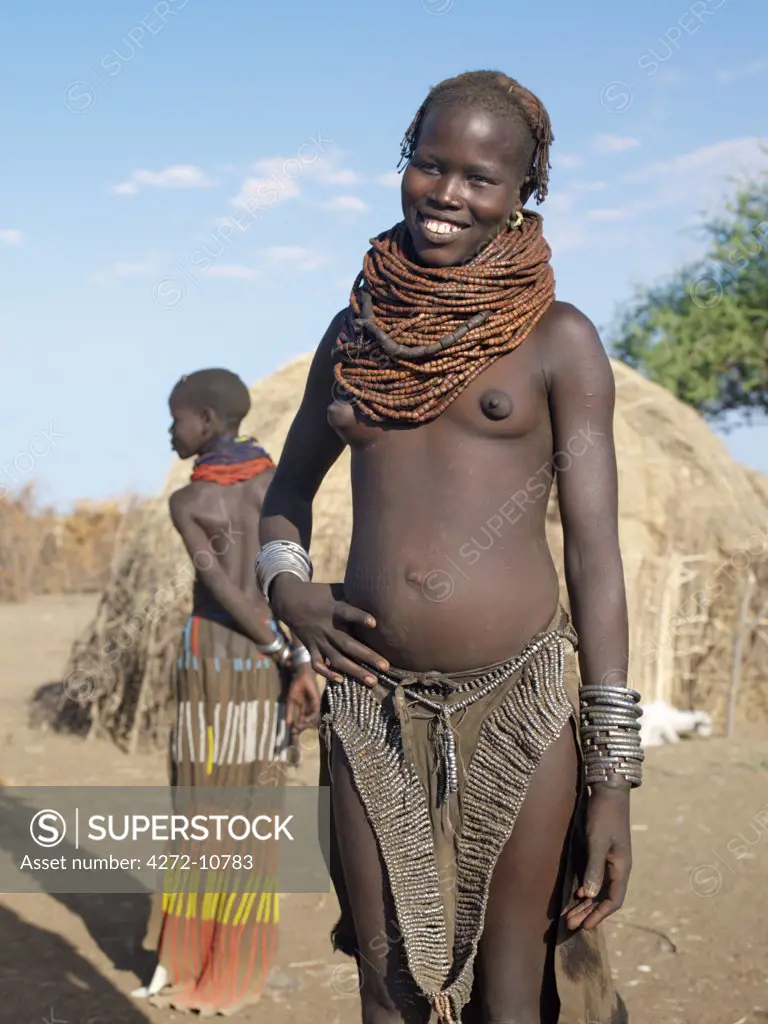 A Nyagatom girl with a large necklace, the beads of which are made of wood.The Nyagatom are one of the largest tribes and arguably the most warlike people living along the Omo River in Southwest Ethiopia.