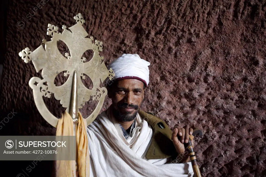 Ethiopia, Lalibela. A priest in one of the ancient rock-hewn churches of Lalibela.