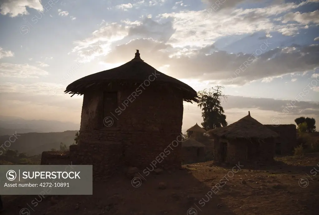 Ethiopia, Lalibela. Traditional huts in Lalibela at sunset.