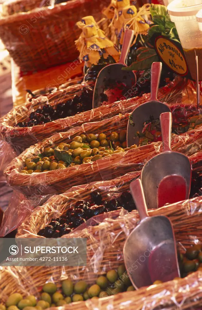 France, Provence, Nice. Baskets of Olives at a market stall in Old Nice. The city is a major tourist centre and a leading resort on the French Riviera (Cote d'Azur)
