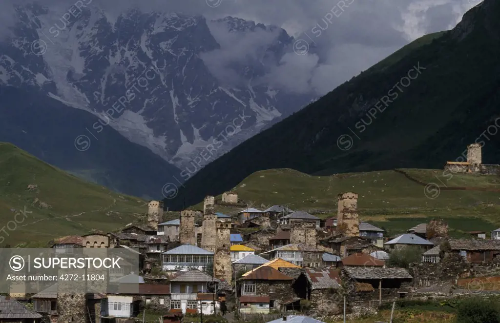 Georgia, Caucasus Mountains, Svaneti. Mt Shkhara, a 5068m peak on the frontier with Russia, dominates the skyline at Ushguli, reputedly Europe's highest permanently inhabited village.