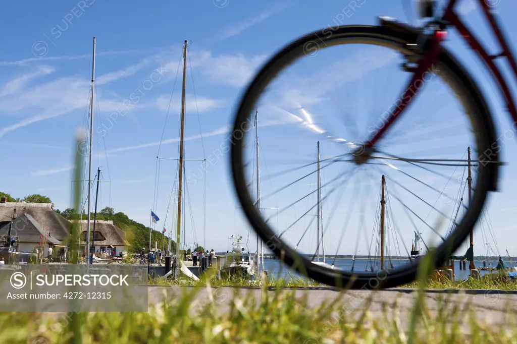 Cyclist in the harbour of Kloster, Hiddensee Island, Mecklenburg-Western Pomerania, Germany
