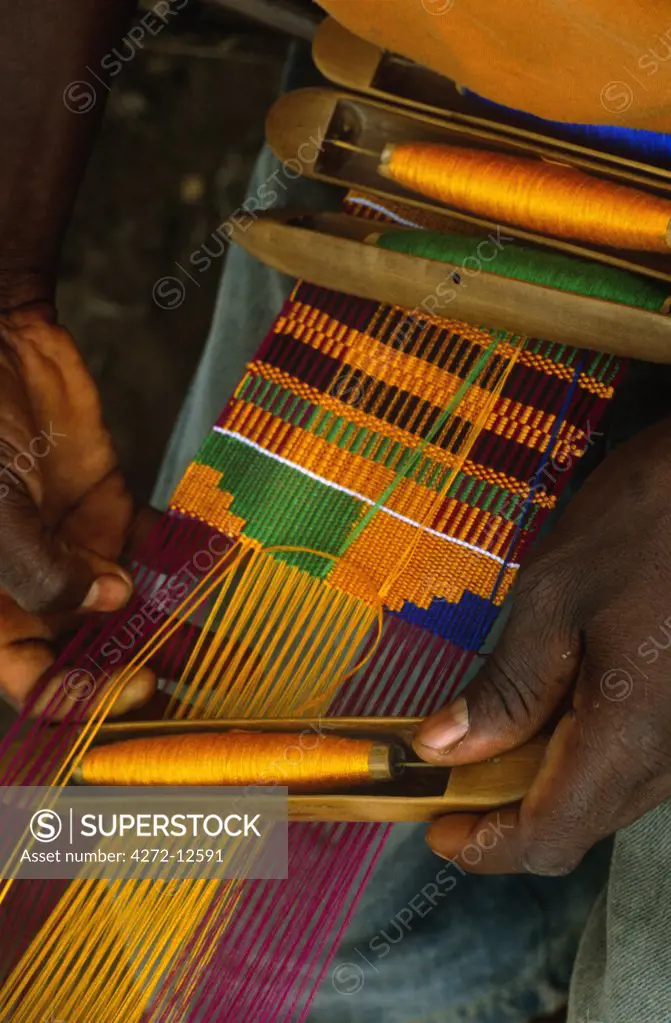 Ghana, Volta region, Tafi Abuipe. Fine Kente cloth being woven. The Ashantis and Ewes both lay claim to having invented it.