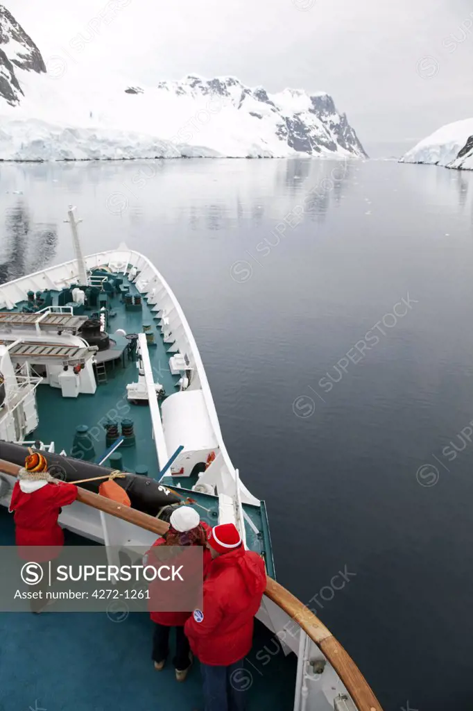 Antarctica, Gerlache Strait.  Exploring the Lemaire Channel located between the Antarctic Peninsula (Graham Land) and Booth Island, sometimes known as 'Kodak Gap' it is one of the top tourist destinations in Antarctica