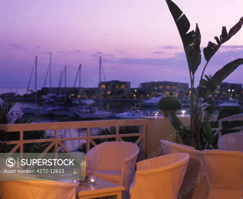 Terrace of bar overlooking the marina with the Asterias Suites in the background